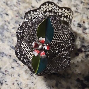Intricate Silver Decorative Piece with Red and Green Accents
